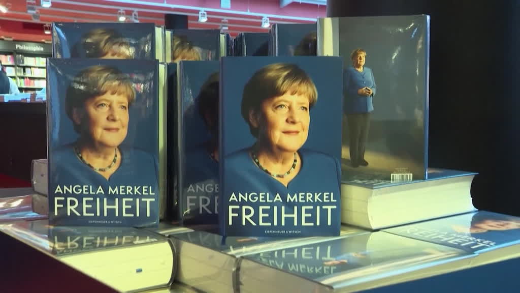 Merkel defends her legacy as memoirs published