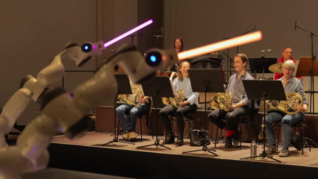 German orchestra performs concert conducted by a robot